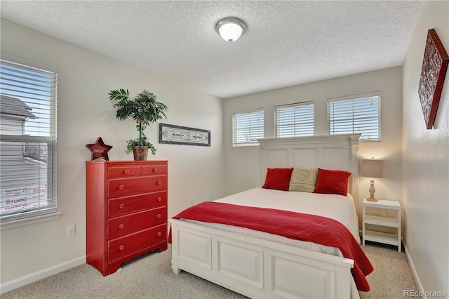 21541 Unbridled Ave, Parker, CO 80138 - bedroom featuring a textured ceiling, light colored carpet, and baseboards