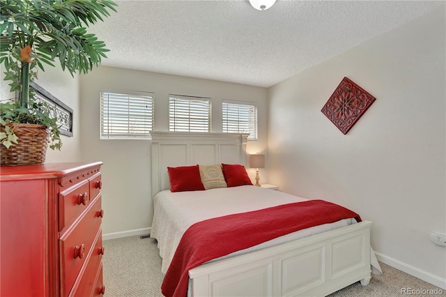 21541 Unbridled Ave, Parker, CO 80138 - bedroom with light carpet, baseboards, and a textured ceiling