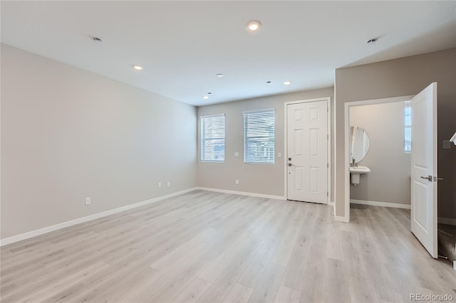 unfurnished room featuring light wood-type flooring