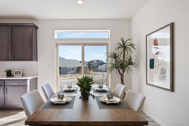 dining area featuring light wood-type flooring