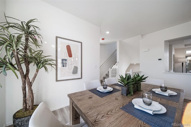 dining area with wood-type flooring