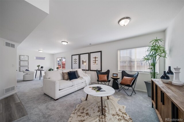 living room with plenty of natural light and light wood-type flooring