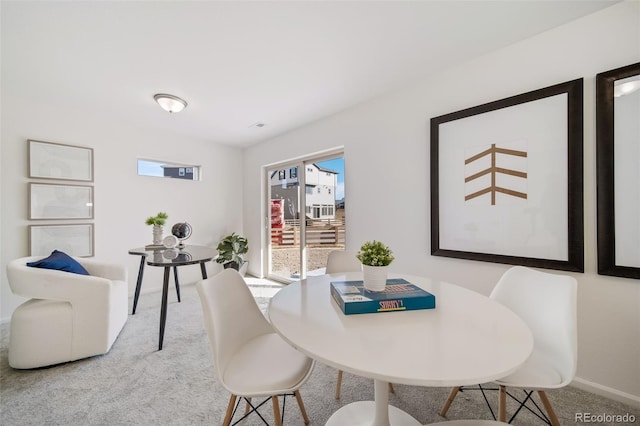 dining room featuring carpet flooring