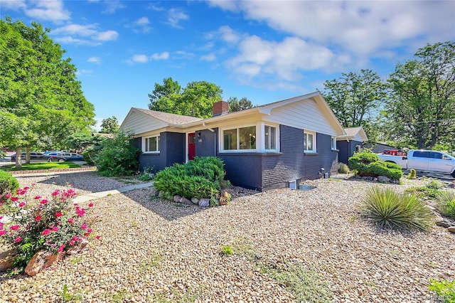 1596 S Stuart St, Denver, CO 80219 - ranch-style house with a chimney and brick siding