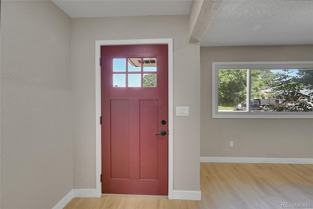 1596 S Stuart St, Denver, CO 80219 - entryway with wood finished floors and baseboards