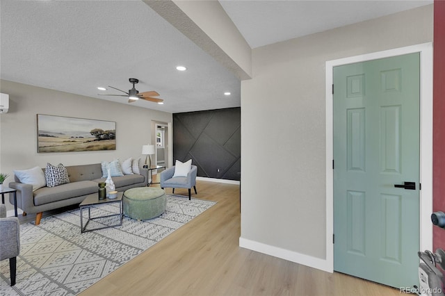 1596 S Stuart St, Denver, CO 80219 - living area with wood finished floors, a ceiling fan, recessed lighting, and a textured ceiling