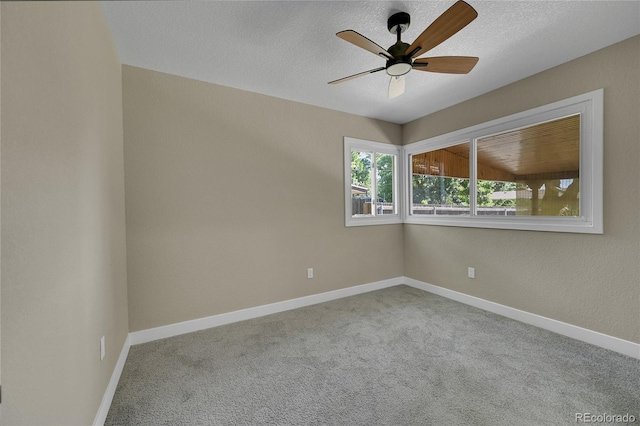 1596 S Stuart St, Denver, CO 80219 - carpeted spare room with ceiling fan and a textured ceiling