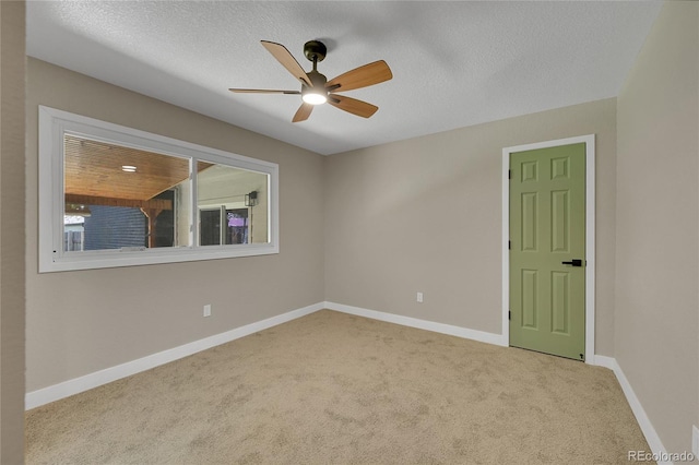 1596 S Stuart St, Denver, CO 80219 - empty room featuring carpet flooring, ceiling fan, and a textured ceiling