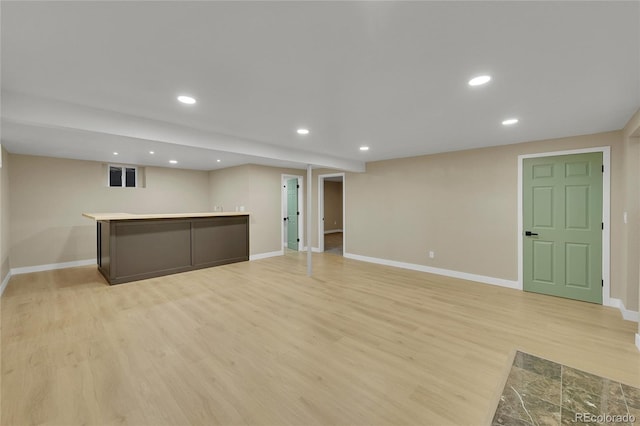1596 S Stuart St, Denver, CO 80219 - finished below grade area featuring light wood-style flooring, recessed lighting, and bar