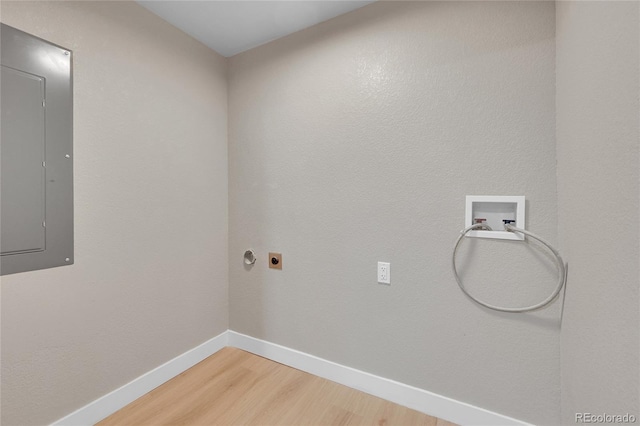 1596 S Stuart St, Denver, CO 80219 - washroom featuring electric panel, washer hookup, light wood-style floors, and electric dryer hookup