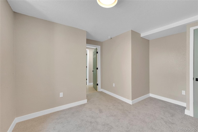 1596 S Stuart St, Denver, CO 80219 - empty room featuring light carpet and baseboards