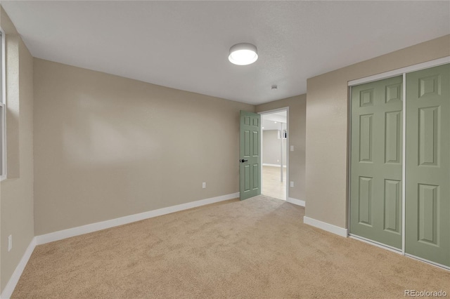 1596 S Stuart St, Denver, CO 80219 - unfurnished bedroom featuring light carpet and a closet