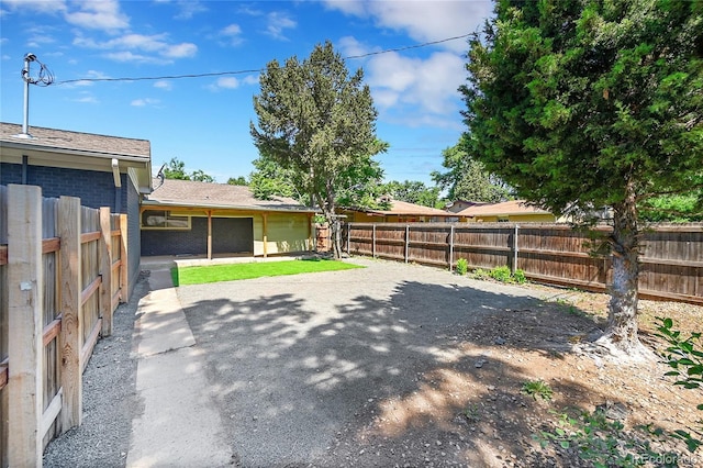 1596 S Stuart St, Denver, CO 80219 - fenced backyard with a patio area
