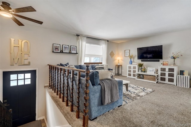 carpeted living room featuring ceiling fan