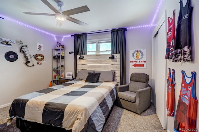 bedroom featuring a ceiling fan and light colored carpet