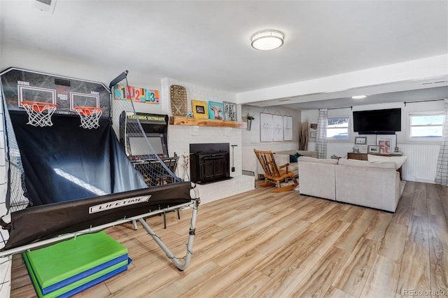 living room featuring wood finished floors and visible vents