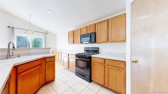 2314 Flagstaff Dr, Longmont, CO 80504 - kitchen featuring black appliances, a sink, vaulted ceiling, light countertops, and light tile patterned floors
