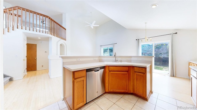2314 Flagstaff Dr, Longmont, CO 80504 - kitchen featuring stainless steel dishwasher, a sink, high vaulted ceiling, light countertops, and a ceiling fan