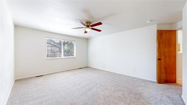 2314 Flagstaff Dr, Longmont, CO 80504 - empty room with carpet flooring, a ceiling fan, baseboards, and a smoke detector