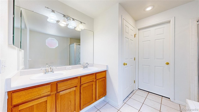 2314 Flagstaff Dr, Longmont, CO 80504 - full bathroom with tile patterned floors, double vanity, and a shower stall
