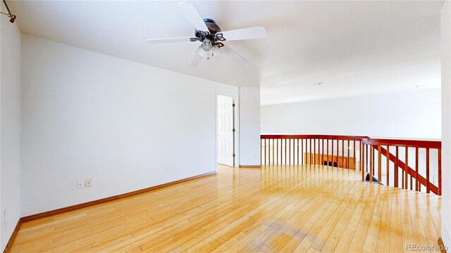 2314 Flagstaff Dr, Longmont, CO 80504 - empty room with ceiling fan, wood-type flooring, and baseboards