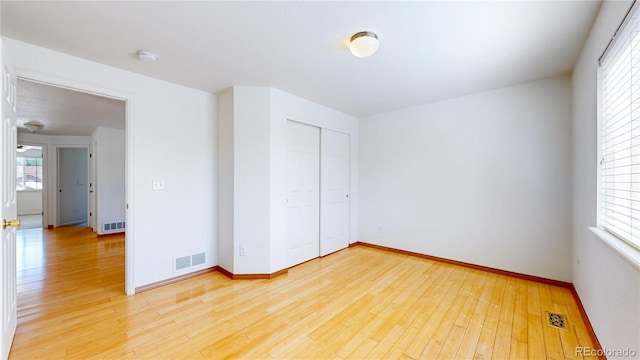 2314 Flagstaff Dr, Longmont, CO 80504 - unfurnished bedroom featuring light wood-style flooring, a closet, and baseboards