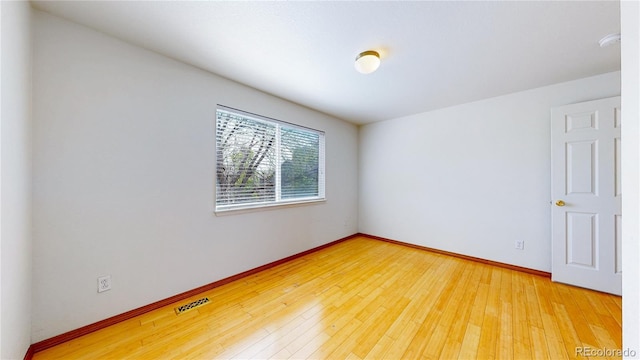 2314 Flagstaff Dr, Longmont, CO 80504 - unfurnished room with baseboards, light wood finished floors, and a smoke detector