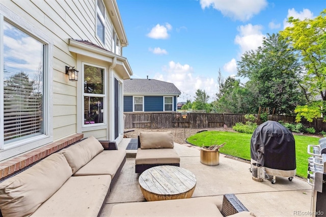 1441 Cherry Pl, Erie, CO 80516 - fenced backyard with outdoor lounge area, a patio area, and a grill