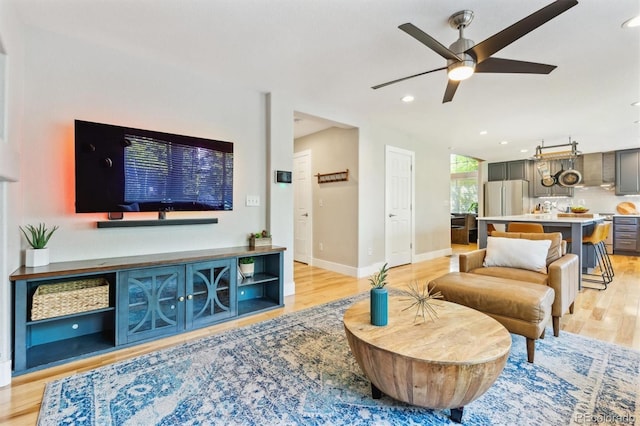 1441 Cherry Pl, Erie, CO 80516 - living room featuring light wood-style flooring, a ceiling fan, and recessed lighting