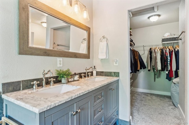 1441 Cherry Pl, Erie, CO 80516 - bathroom featuring double vanity and a walk in closet
