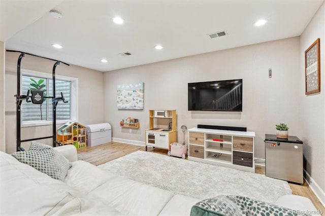 1441 Cherry Pl, Erie, CO 80516 - living area with wood finished floors and recessed lighting