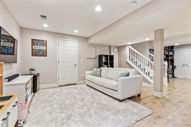 1441 Cherry Pl, Erie, CO 80516 - living room featuring light wood-type flooring, stairway, and recessed lighting