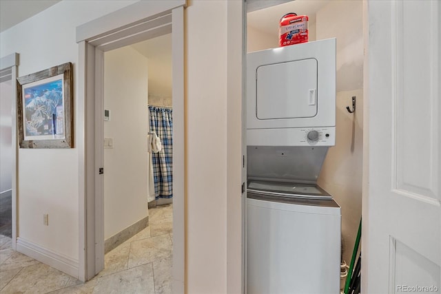 laundry room with stacked washer / dryer