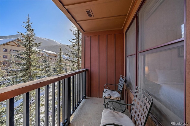 balcony featuring a mountain view