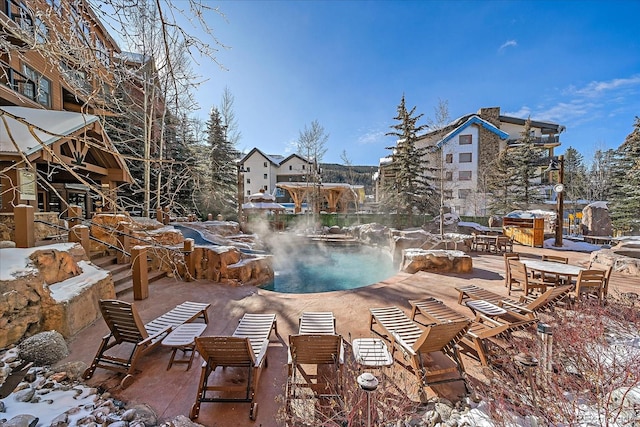 view of snow covered pool