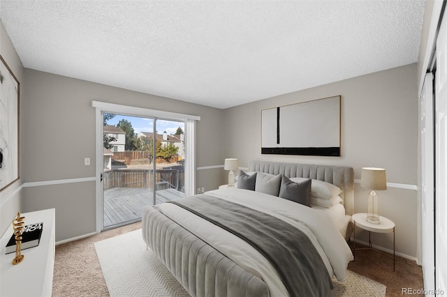 bedroom with access to outside, a textured ceiling, and light carpet