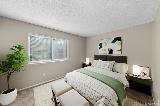 bedroom featuring a textured ceiling and carpet