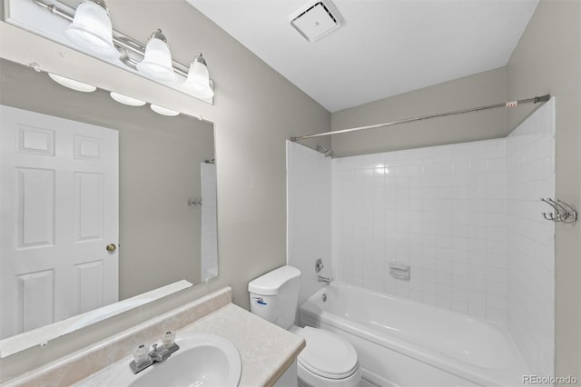 full bathroom featuring vanity, toilet, and tiled shower / bath combo