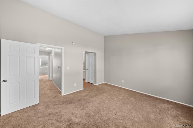 unfurnished bedroom featuring light colored carpet