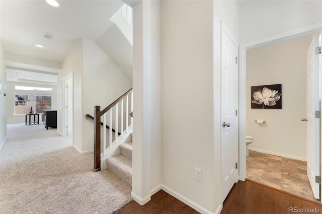 staircase with baseboards and recessed lighting