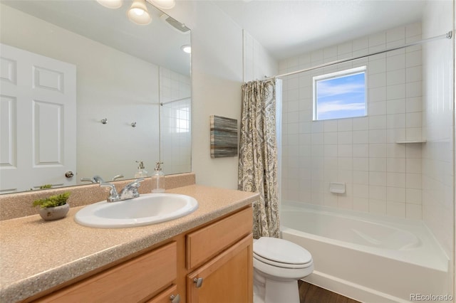 bathroom with toilet, shower / bath combo, and vanity