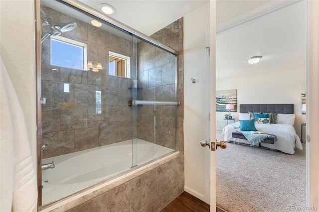bathroom featuring tiled shower / bath and ensuite bathroom