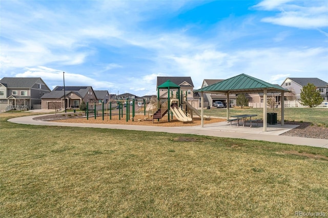 communal playground featuring a residential view, a gazebo, and a yard