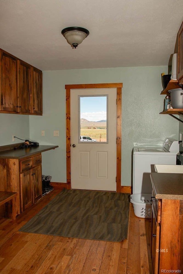 kitchen featuring separate washer and dryer and hardwood / wood-style floors