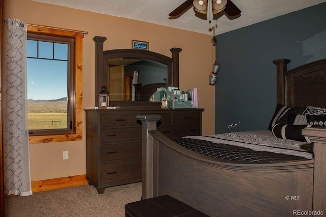 bedroom with ceiling fan and light colored carpet