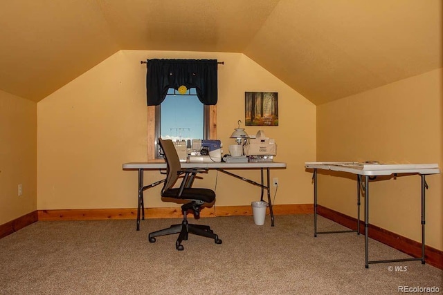 office space with vaulted ceiling and carpet floors