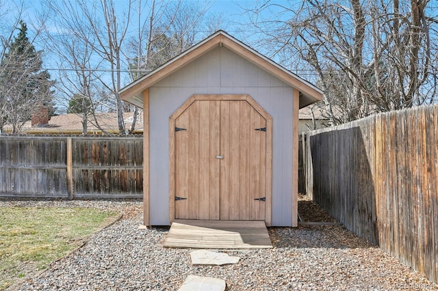 view of shed featuring a fenced backyard