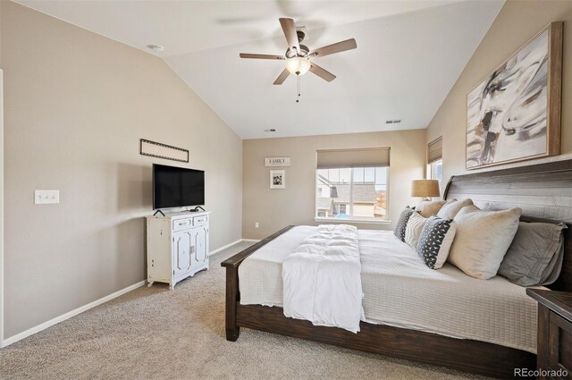 bedroom featuring visible vents, baseboards, ceiling fan, vaulted ceiling, and light carpet