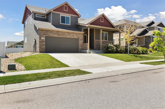 719 Elk Mountain Dr, Severance, CO 80550 - craftsman house with driveway, a porch, and an attached garage