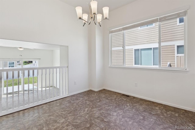 719 Elk Mountain Dr, Severance, CO 80550 - empty room with a chandelier